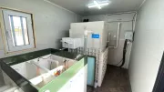 The inside of of a waste water treatment container, including pipes and the UNICEF logo.