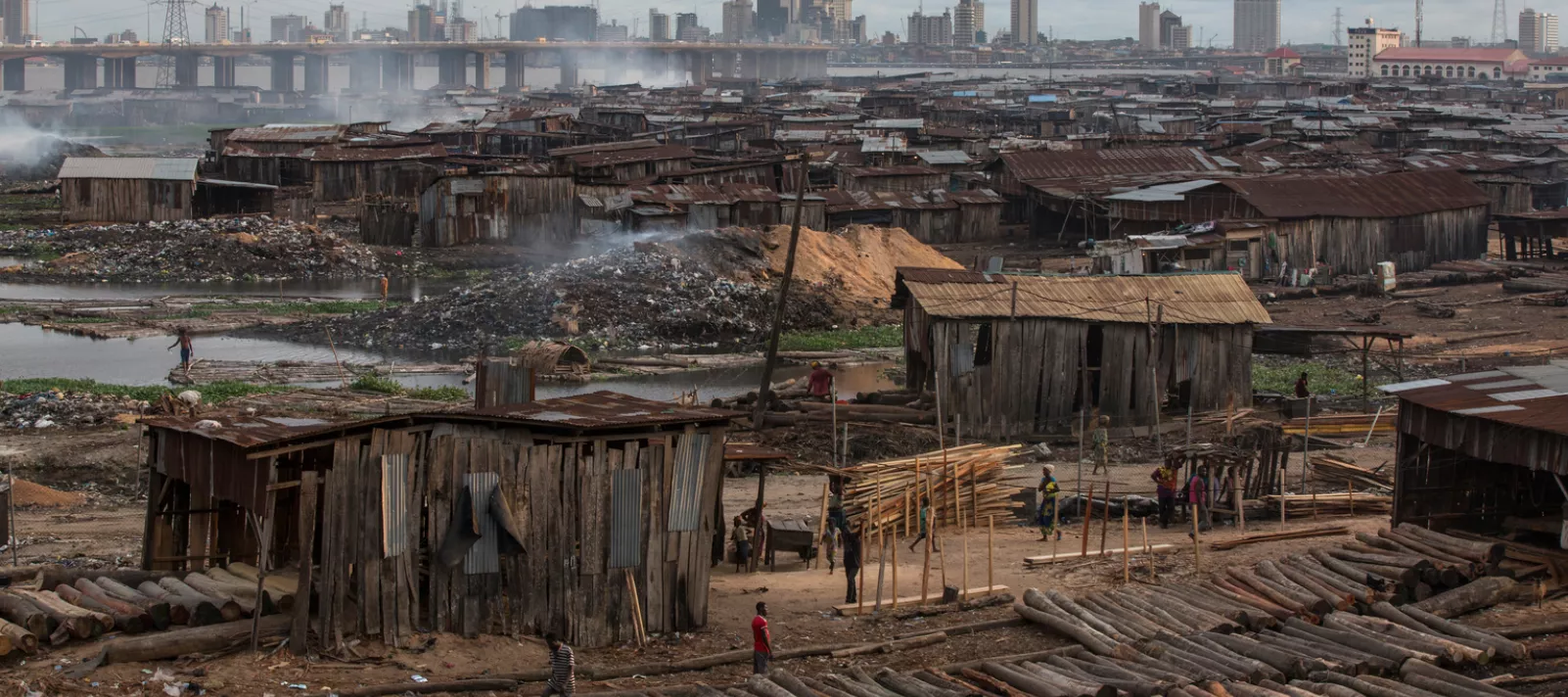In Lagos, Nigeria, smoke rises above the Okobaba sawmill industries at the Ebute-Metta district