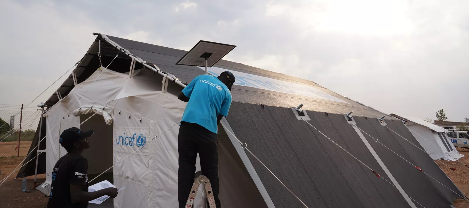 People Assembling UNICEF's High Performance Tents