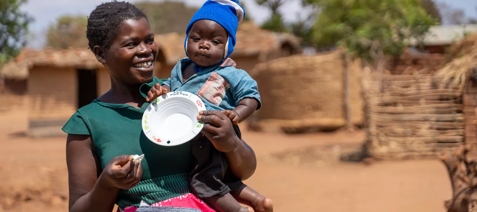Mother and child holding the bowl