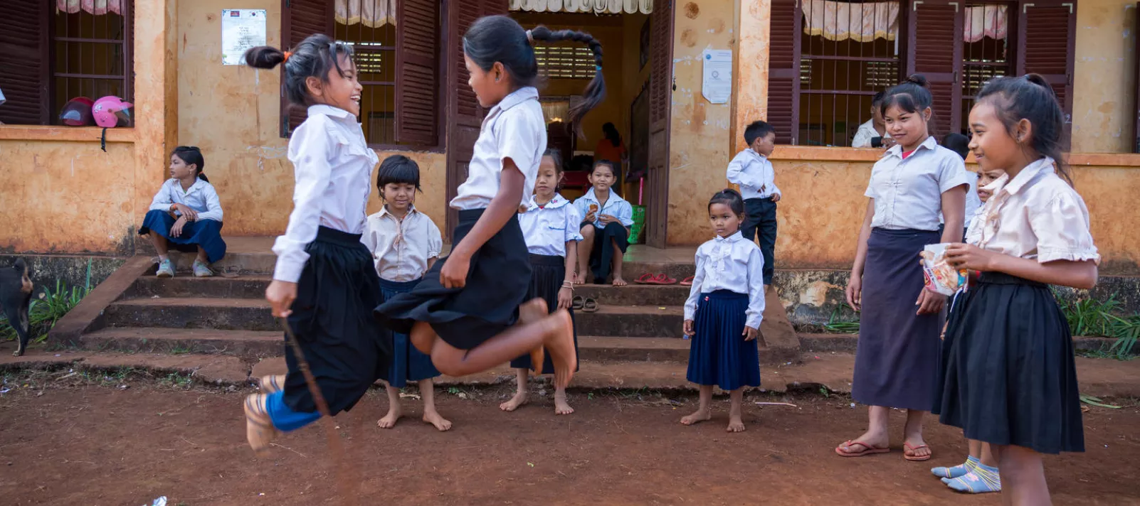 girls in cambodia in school playing during a break 