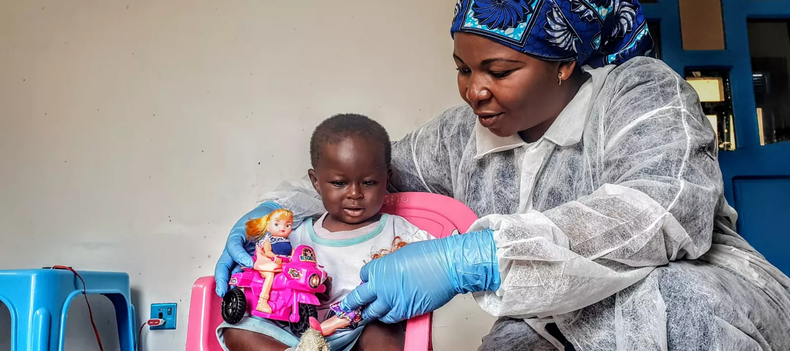 Caregiver and child in health facility