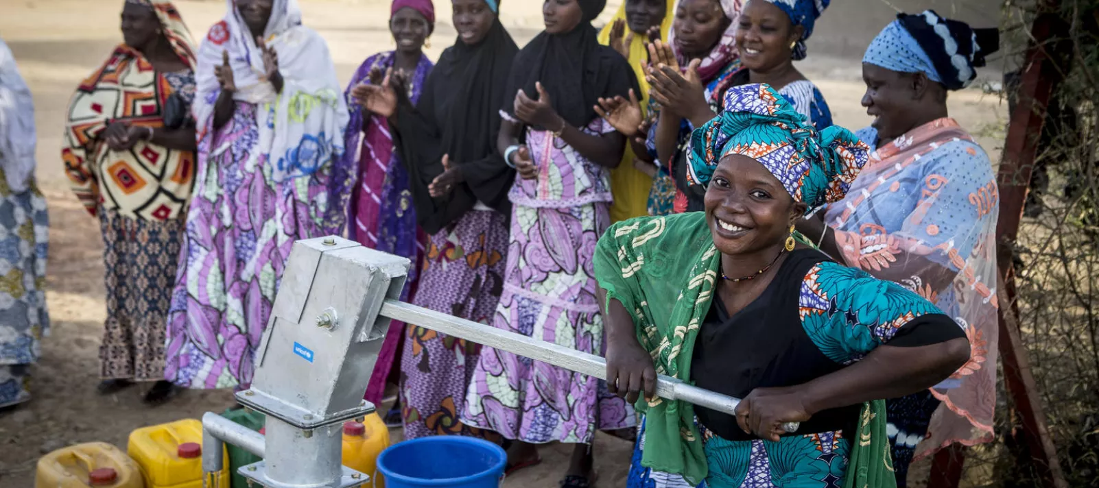Woman use pump to pour water