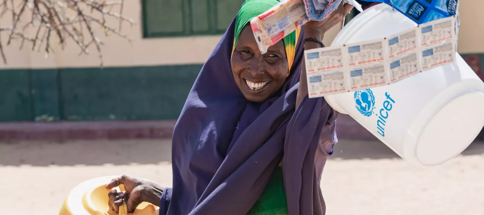Ebla, a mother of nine, received tokens from UNICEF to select extra WASH items according to her family&rsquo;s needs in drought and flood-affected Kenya. 