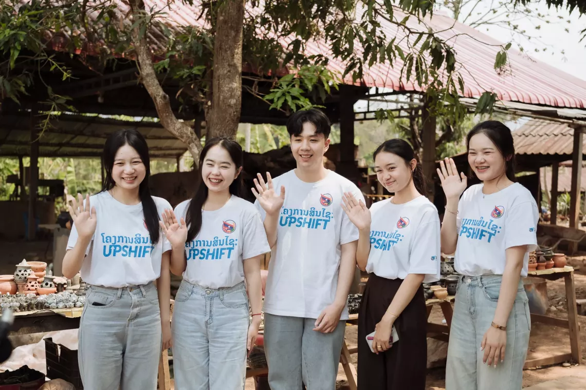 young people waving in Lao