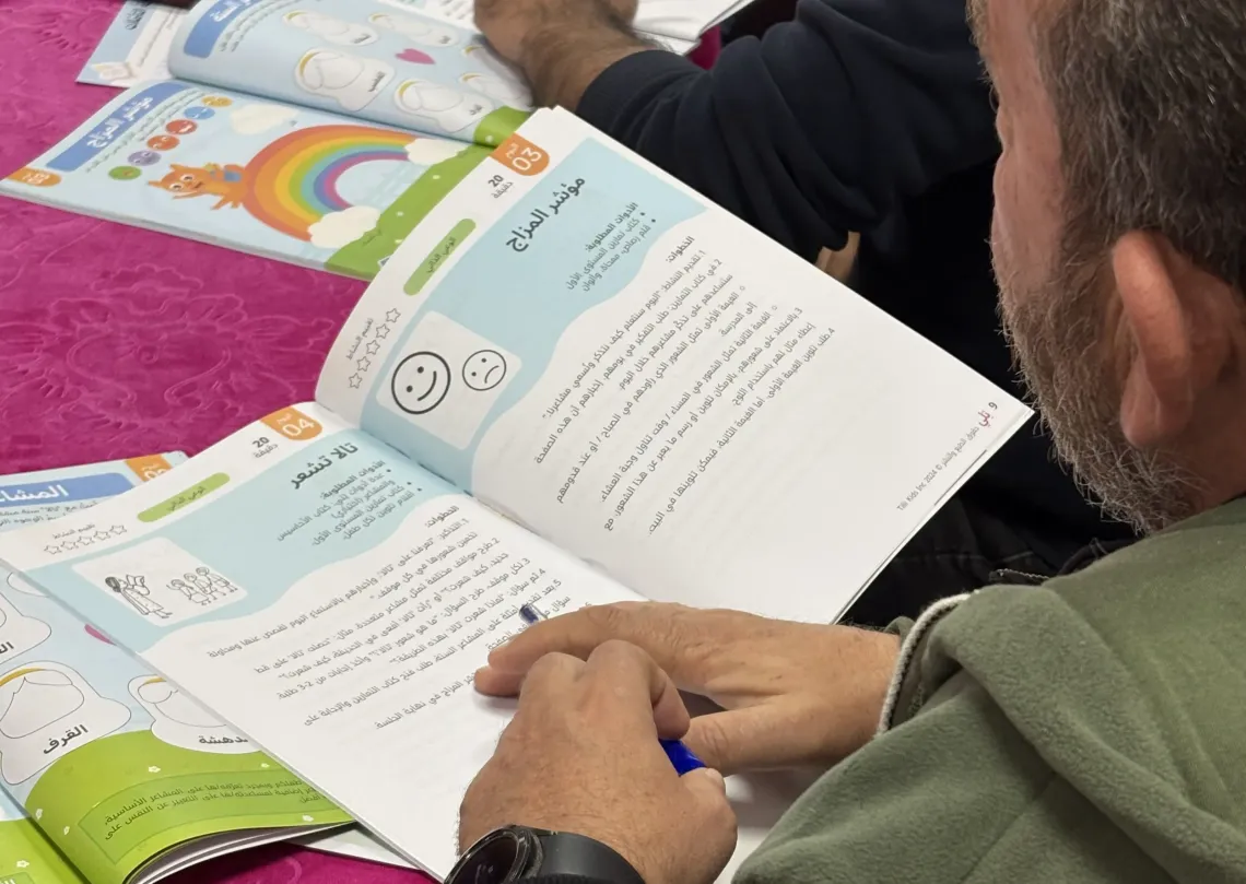 looking at an instruction booklet