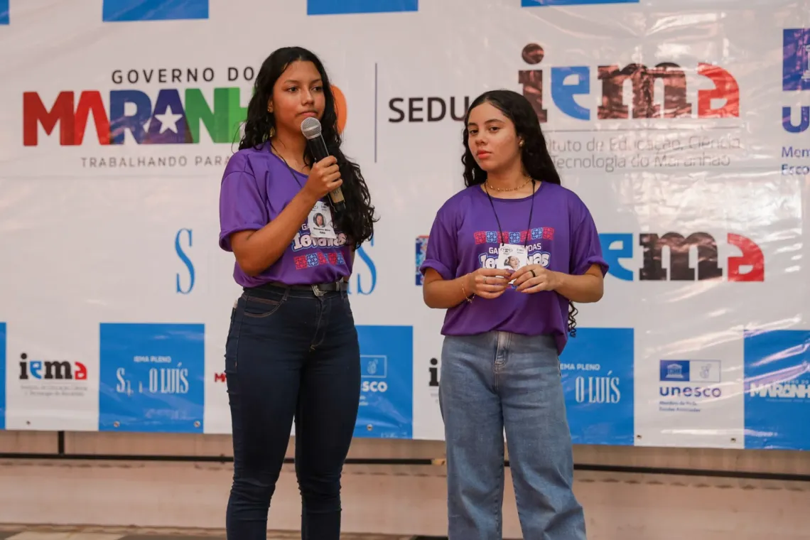 Giovanna and one of her teammates present the video game they designed and built in just 48 hours to fellow game jam participants