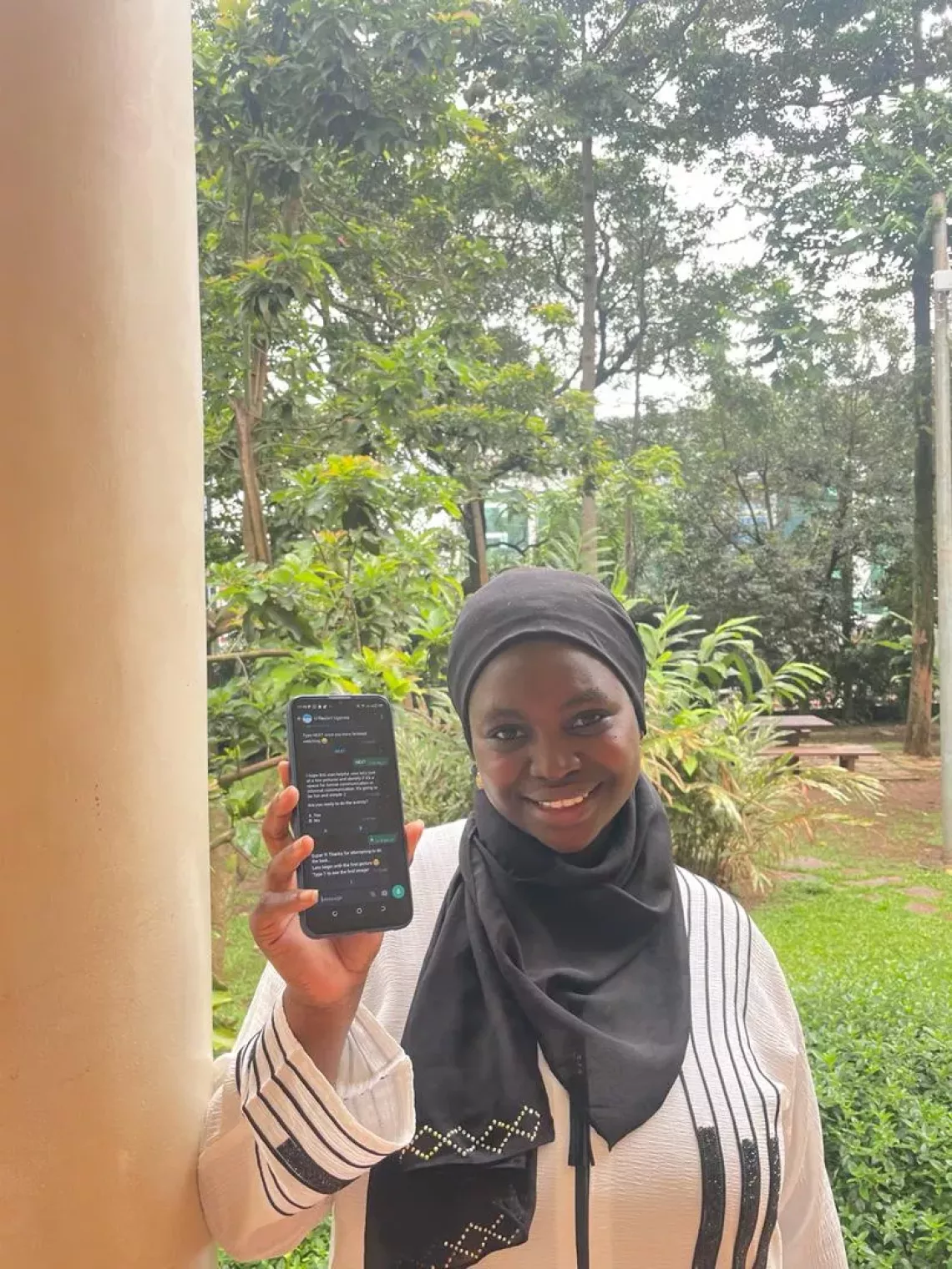 Young girl with her phone in Uganda
