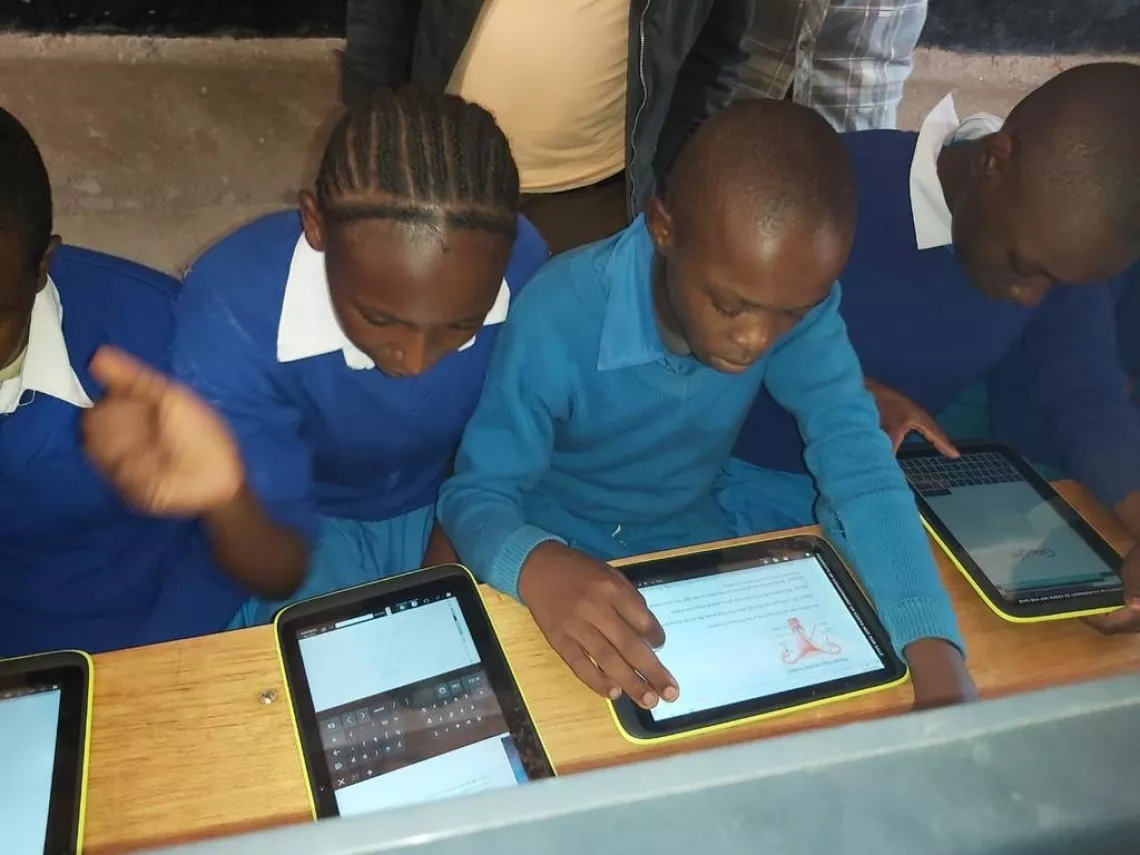 Kikongooni Primary School students using the eLearning platform during a Science class