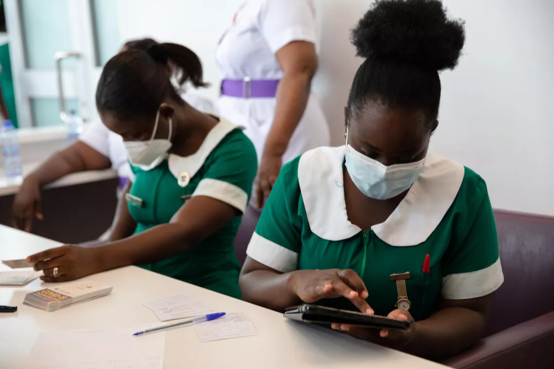 Health workers collect data at the Ridge Hospital in Accra, Ghana.