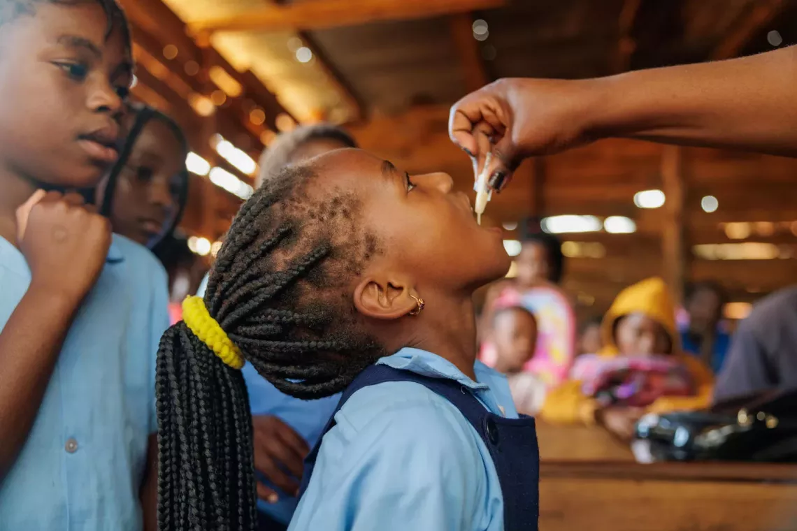 child receives vaccine orally