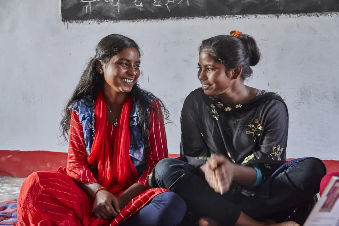 Two young woman talking