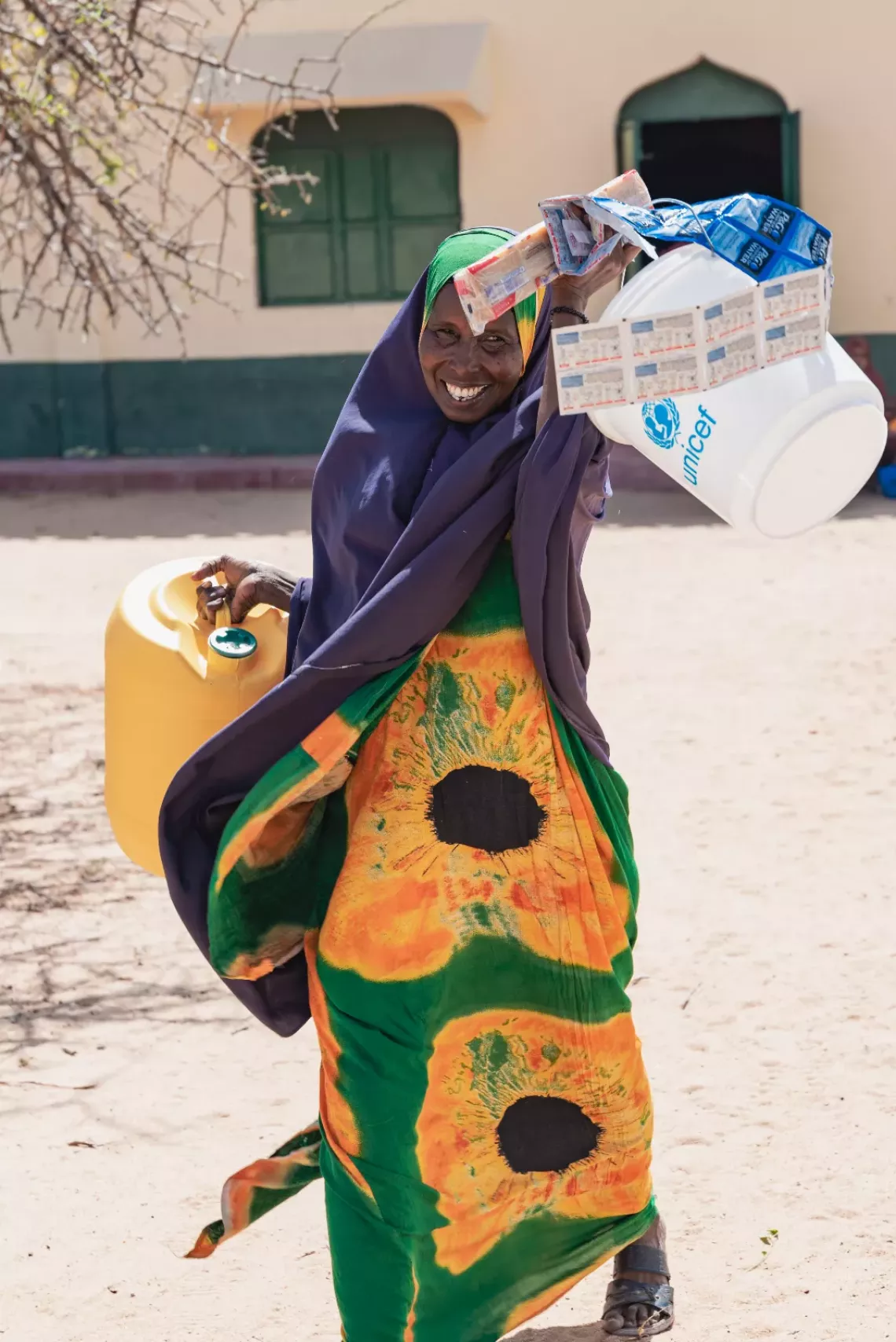 Mother in Kenya with WASH kits