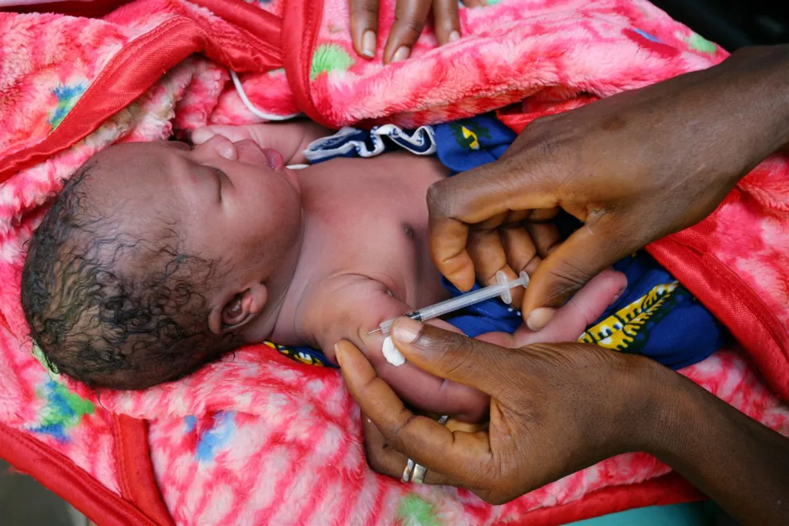 A health worker vaccinates an infant at Redemption Hospital in New Kru Town, a neighbourhood of Monrovia, Liberia.