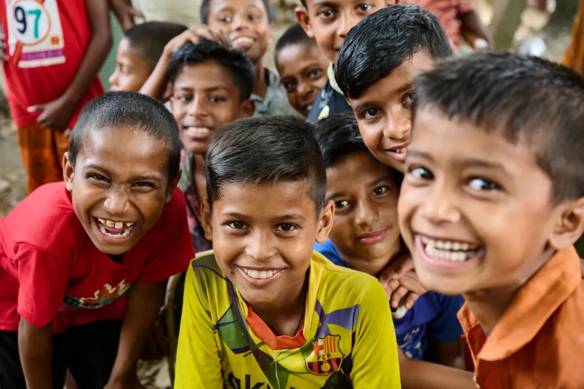 A group of children gathers around the Moddho Nagar, Uktyargaon, EPI centre in Tahirpur, Sunamganj, Bangladesh.