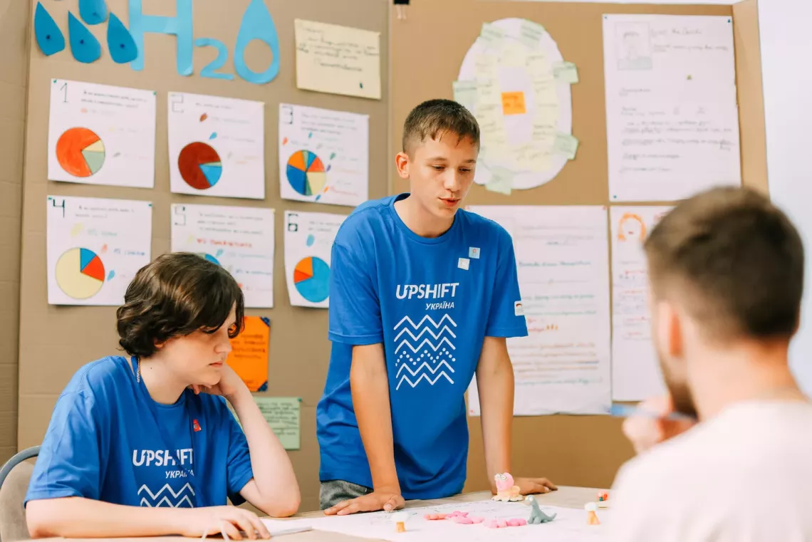children talking in a classroom