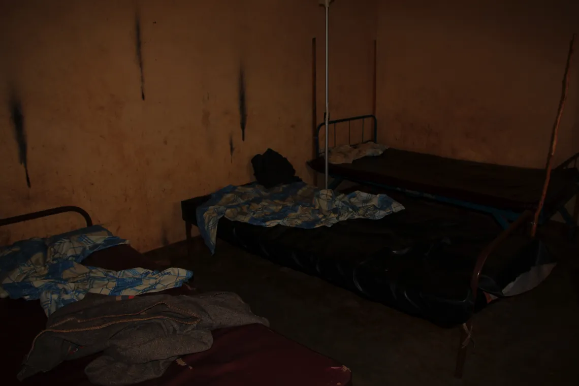 Inside a health center in Gitega province, smoke from kerosene lamps stains the walls