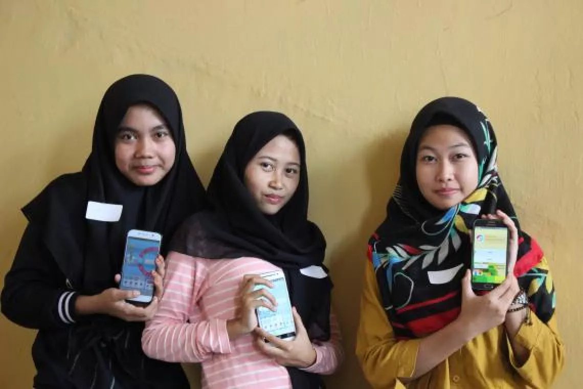 User testing Oky with girls in Indonesia.