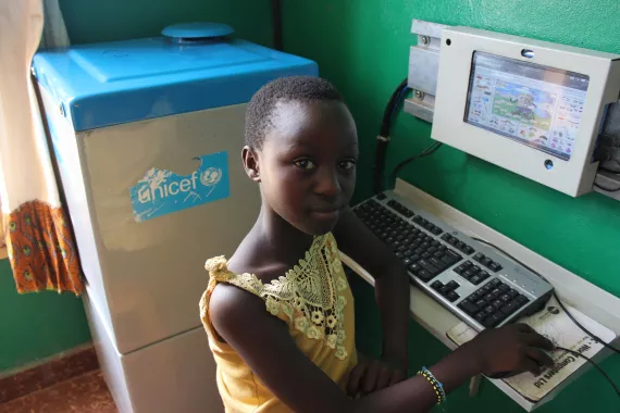 A girl uses a digital drum in Cibitoke, Bujumbura.
