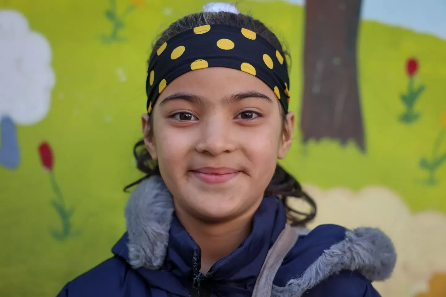 A girl smiling at school