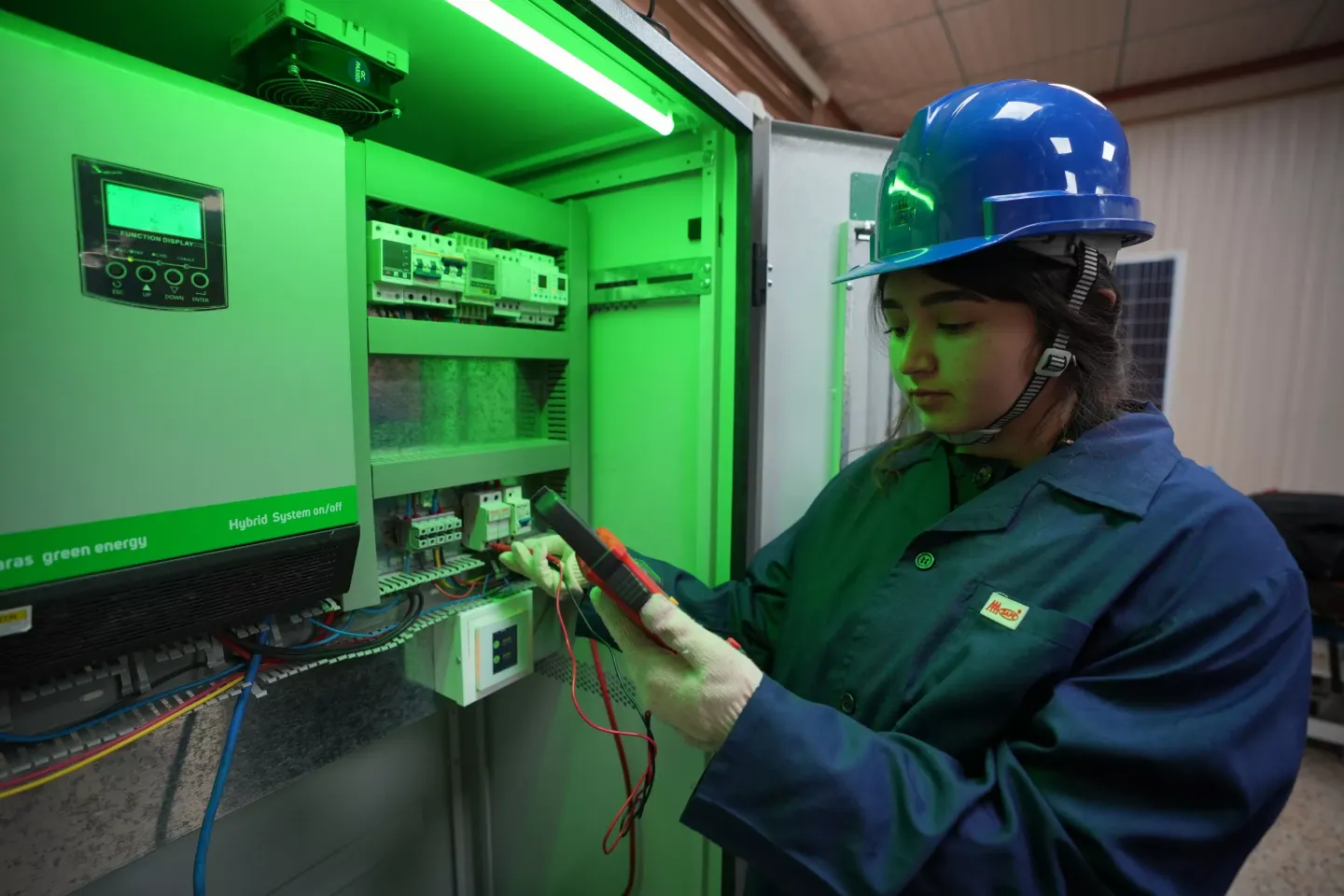 Lava Salih assessing the efficiency of the installed solar system. in Erbil Governorate, Iraq.   