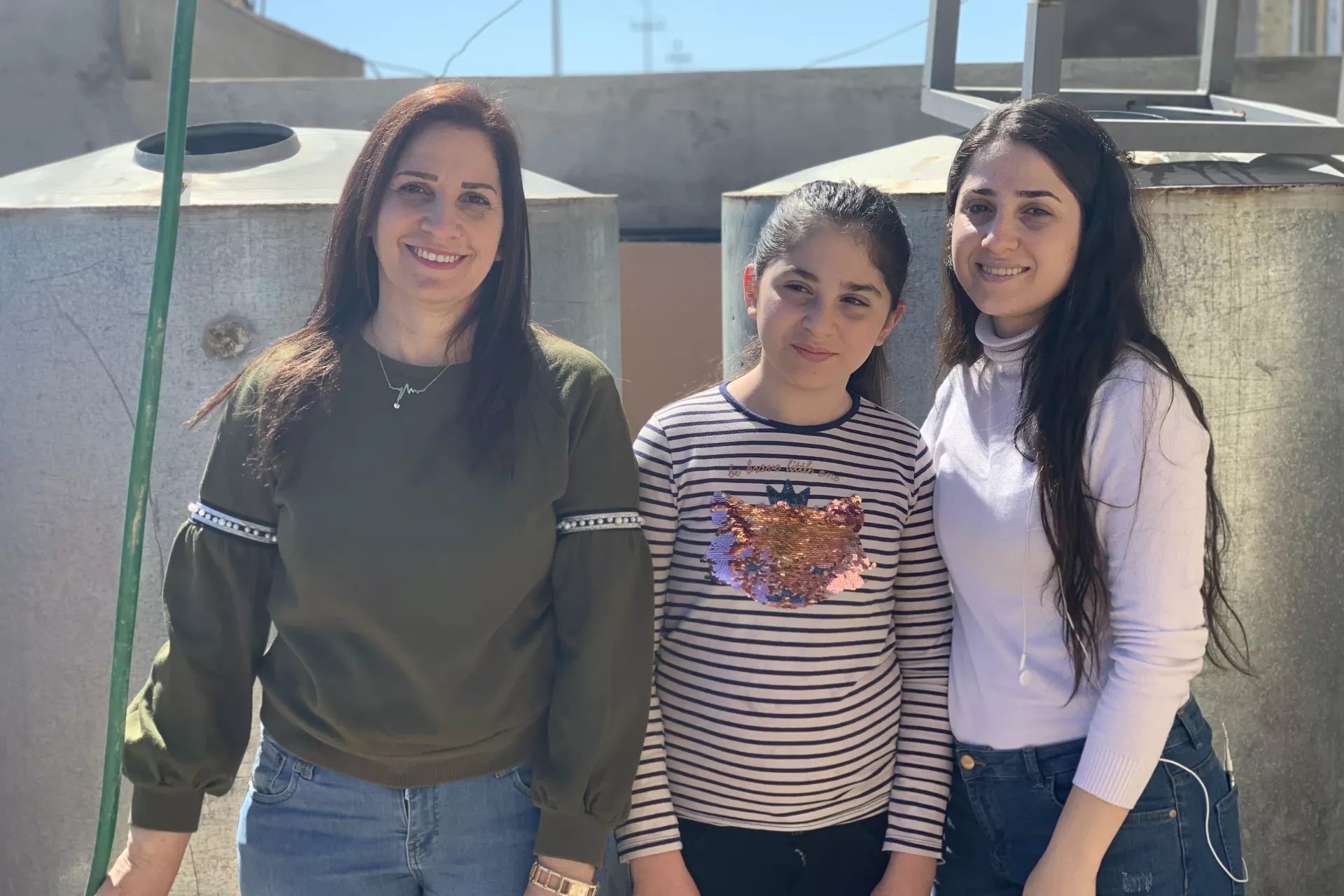 Raida Shamoon and her daughters Ronak and Hadeel outside their home  