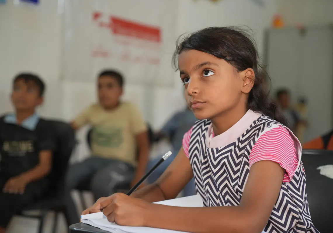 Young girl attending class in school in Iraq