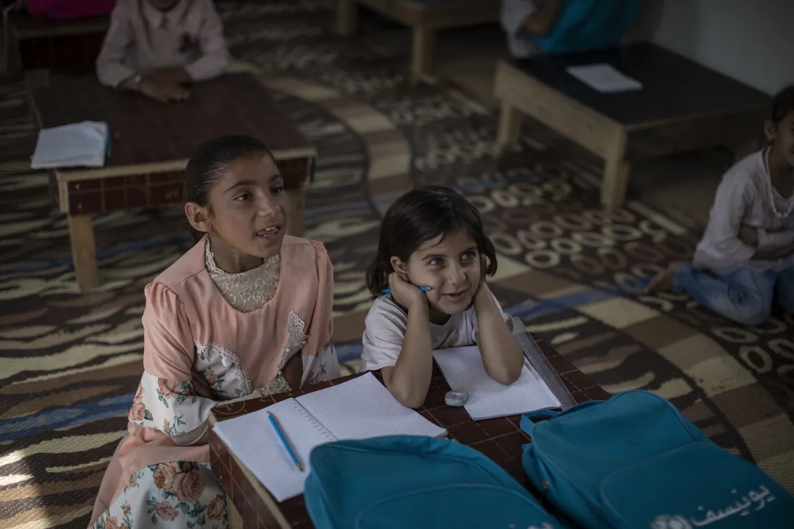 On May 17, 2023, Ashwaq, 10, from a village between Nineveh and Salah al-Din, poses for a portrait inside her home located at Hassansham U2 IDP camp. She has been living in Hassansham camp since 2019.