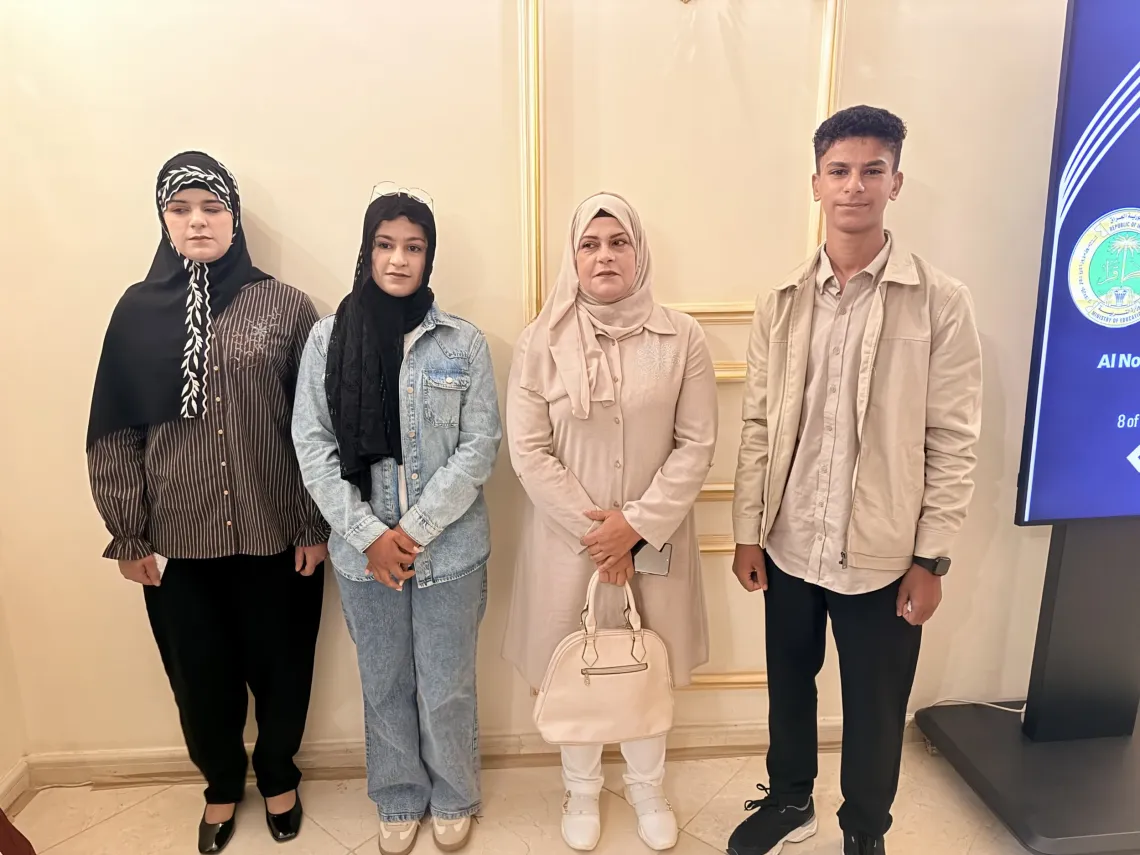 Together again, hopeful for the future. Suhaib, his mother, and his siblings in Baghdad during the national launch of the 2026 Back to Learning campaign celebrate the children&rsquo;s return to learning.