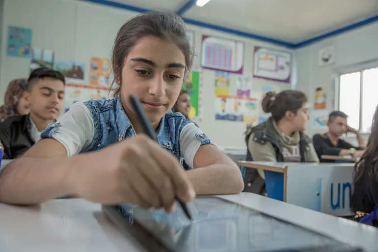 A girl in her class in Iraq 