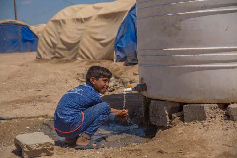 A child is washing his hands 