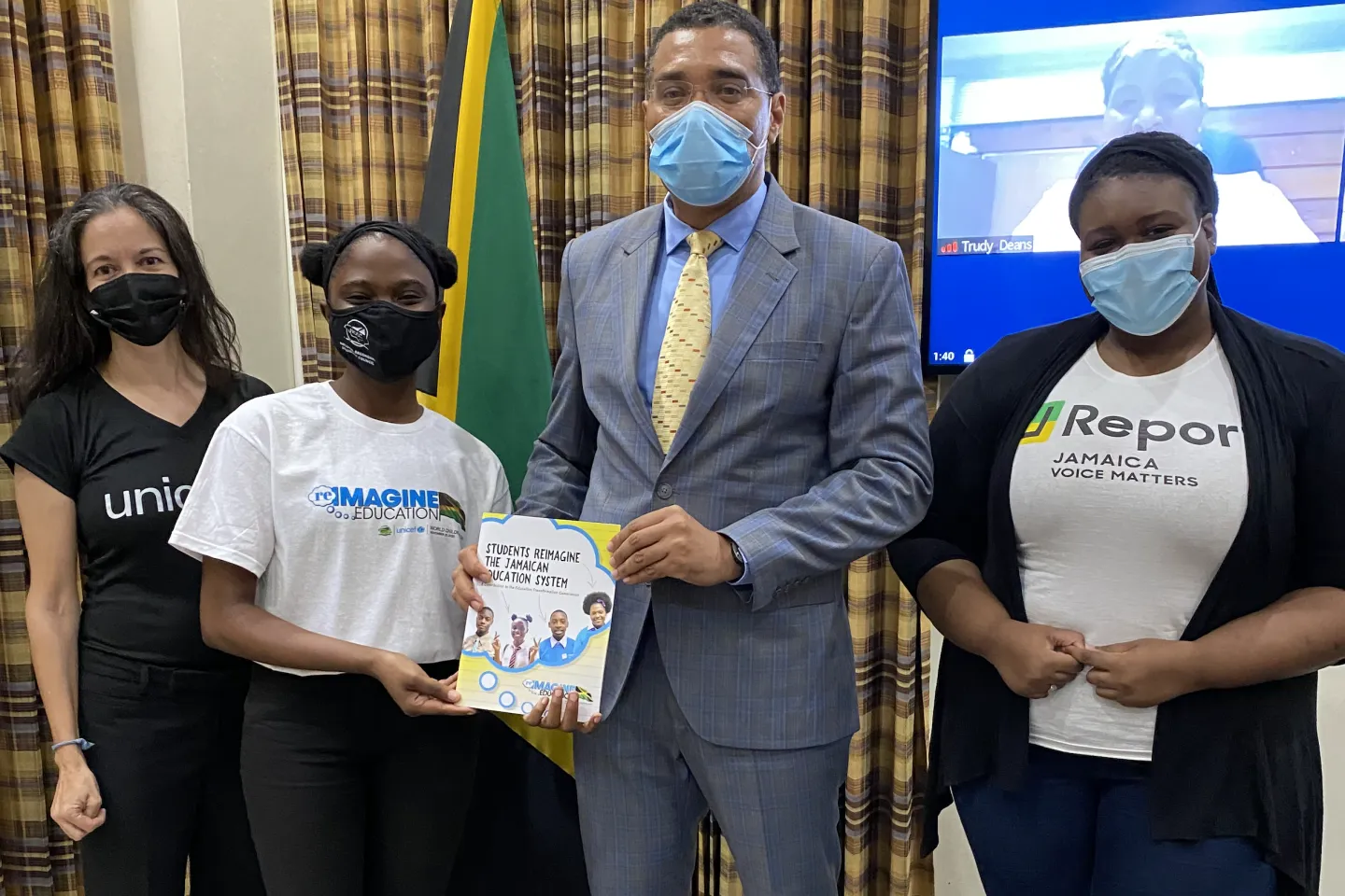 Prime Minister Andrew Holness receives a copy of the &lsquo;Students Reimagine the Jamaican Education System&rsquo; report, a product of the &lsquo;Reimagine Education&rsquo; initiative by UNICEF and the National Secondary Students&rsquo; Council (NSSC). Also pictured (left to right) are UNICEF Education Specialist Rebecca Tortello and NSSC members Destini Edwards and Ree-Anna Robinson.