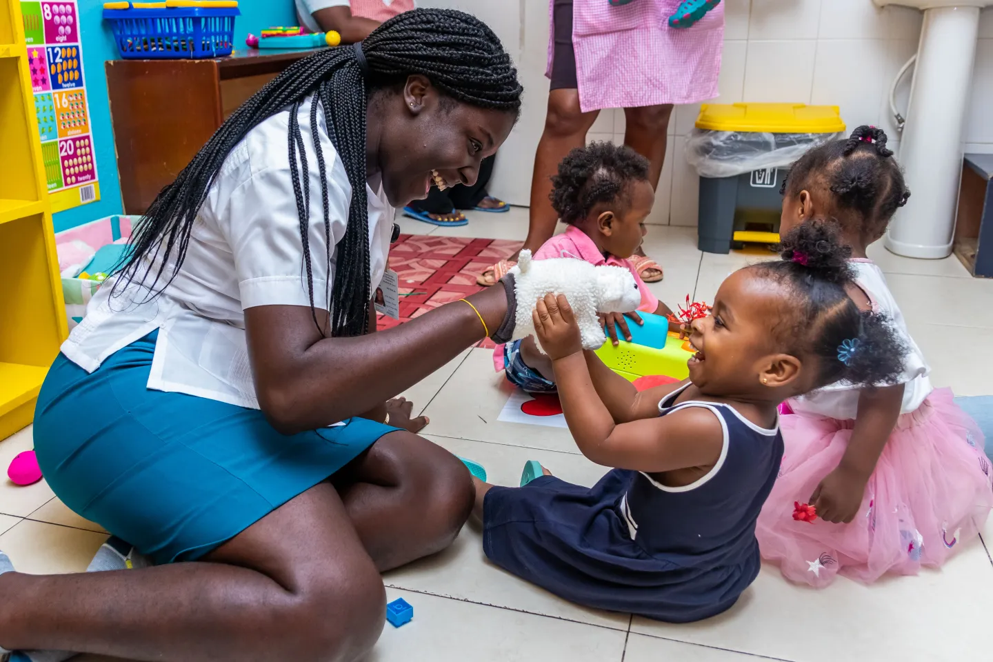 Caregiver playing a game with a child