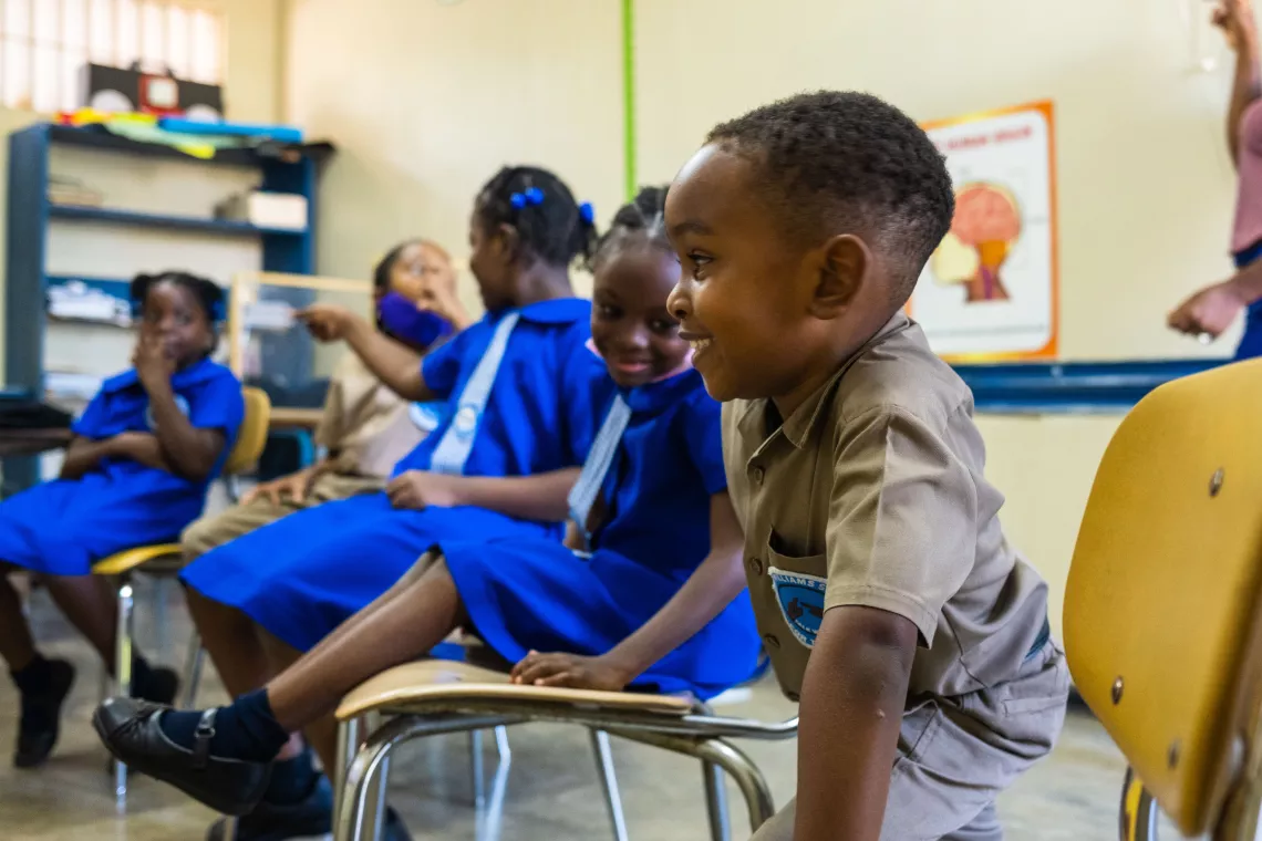 Ari and his classmates enjoy learning technology in class.