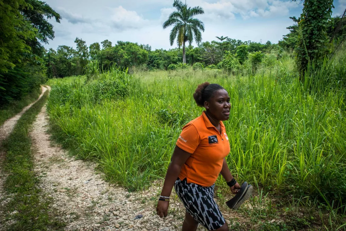 eve for life mentor mom monique McDonald walking along a track in a rural area of jamaica