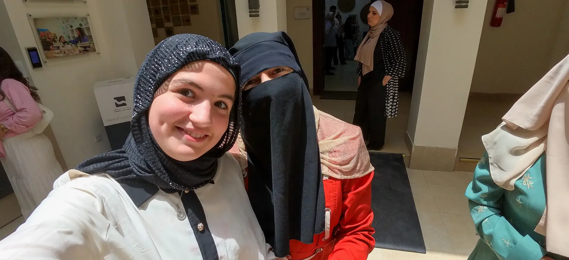A daughter takes a selfie with her mother. 