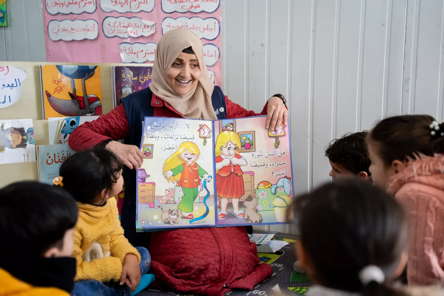 A teacher reading for kindergartners. 