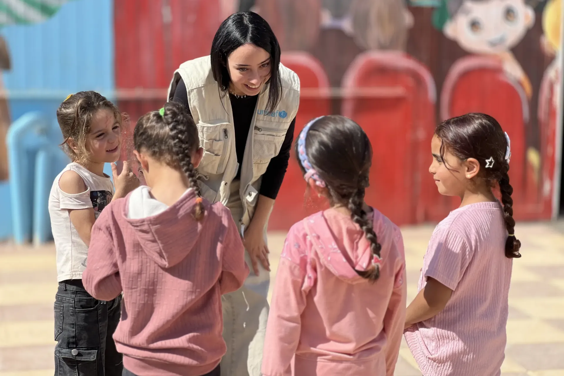 Jana, a UN volunteer, spending time and connecting with the children.