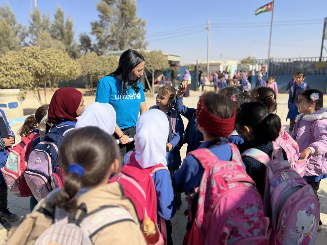 Children gathered around Jana, sharing smiles and stories