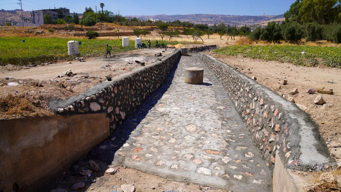A newly paved lined channel.