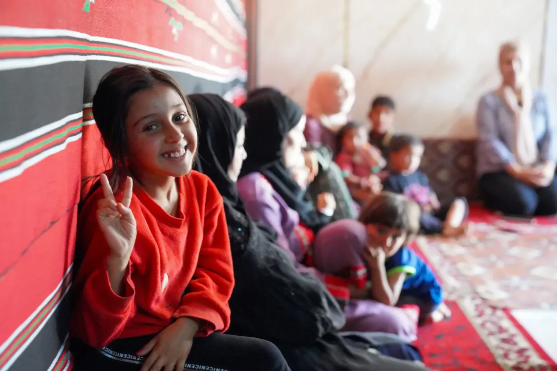 A girl smiling. 