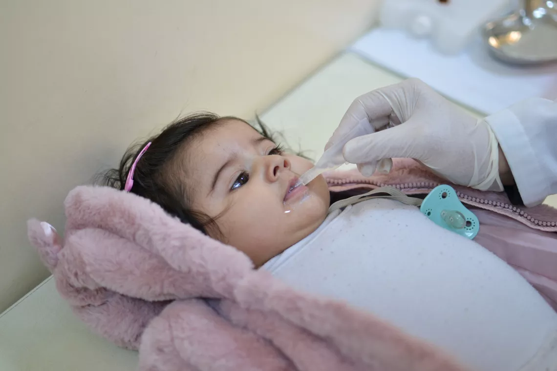 Rose at Jubaiha Center getting her polio vaccine