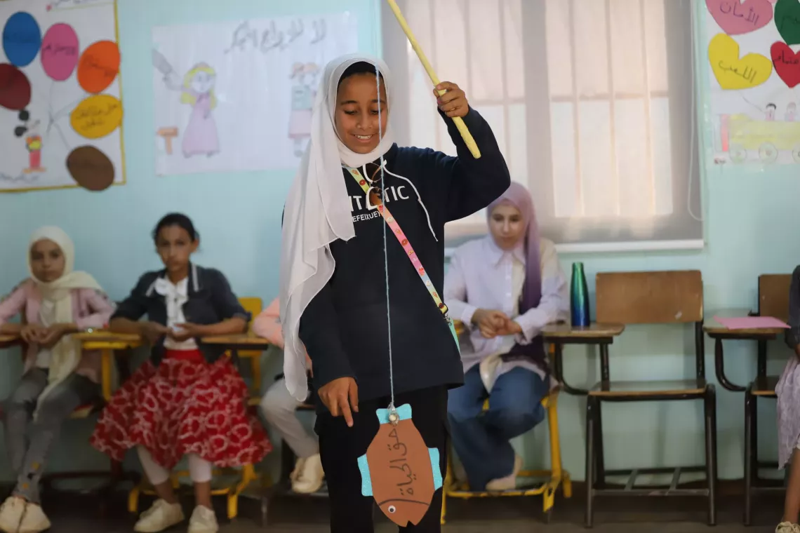 A girl participating in an activity in class.
