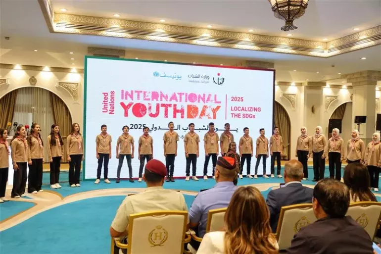 Young people presenting on stage. 