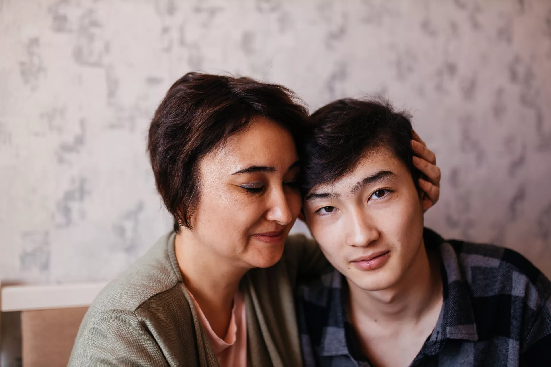 Aizhan Yerulanova and her son, Yerasyl (16). Ust-Kamenogorsk, Kazakhstan.