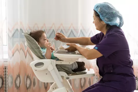 Baby in residental care facility in Astana