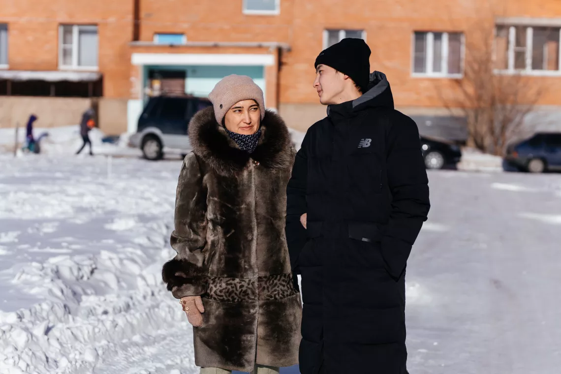 Aizhan Yerulanova and her son, Yerasyl, out for a walk. Ust-Kamenogorsk, Kazakhstan.
