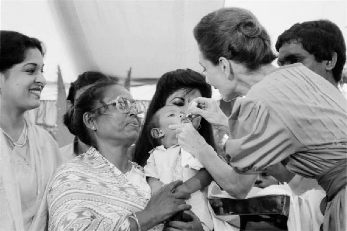 Bangladesh, 1989. UNICEF Goodwill Ambassador Audrey Hepburn vaccinates a child against polio at a health clinic.