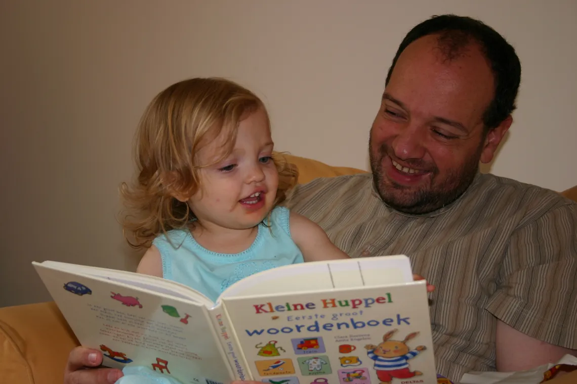 Arthur reading to his daughter Laura