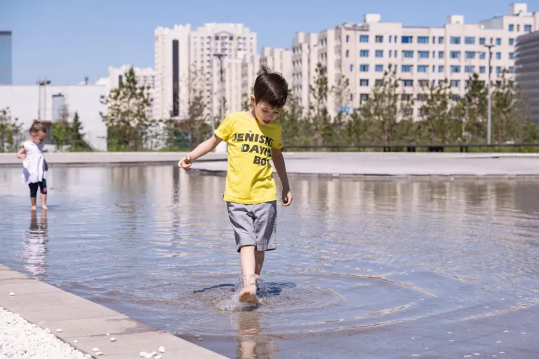 a boy walking on the water